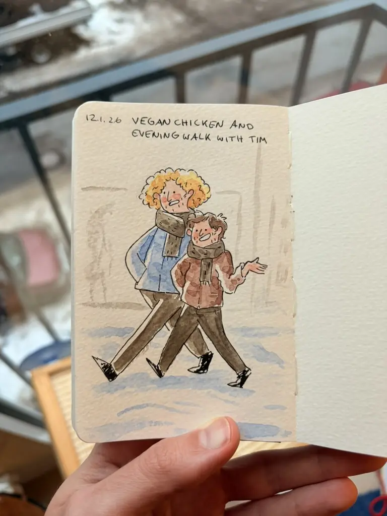 Marcel and Tim walk together outdoors.