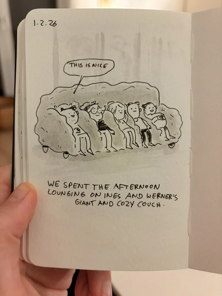 A group of friends lounges together on Ines and Werner's sofa.
