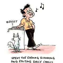 Marcel scans and edits comics while a cat stands beside the scanner.